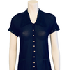Dark blue, sheer, short-sleeve jumpsuit with pearl buttons and lace-trimmed collar, sleeves, and pant cuffs. 