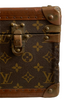 Large, hard, leather suitcase with an all-over “LV” monogram print. Brass hardware with "LV" stamp.