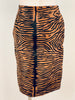 Back view of mannequin wearing tiger stripe printed pony hair pencil skirt by Bill Blass. 